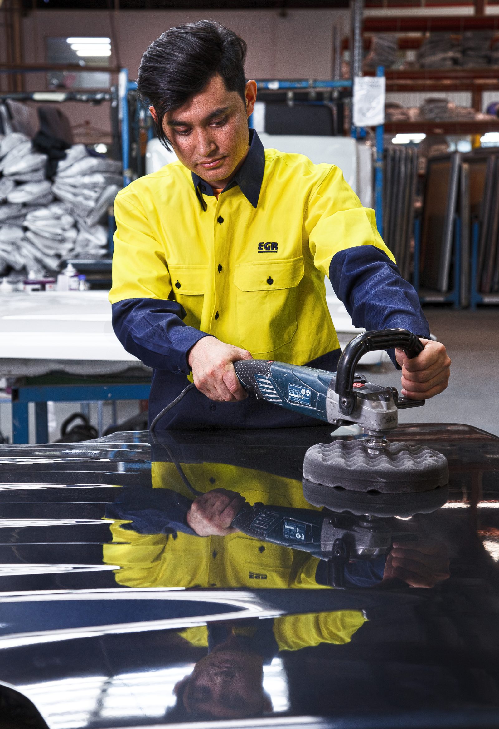 EGR technician polishing a manufactured component