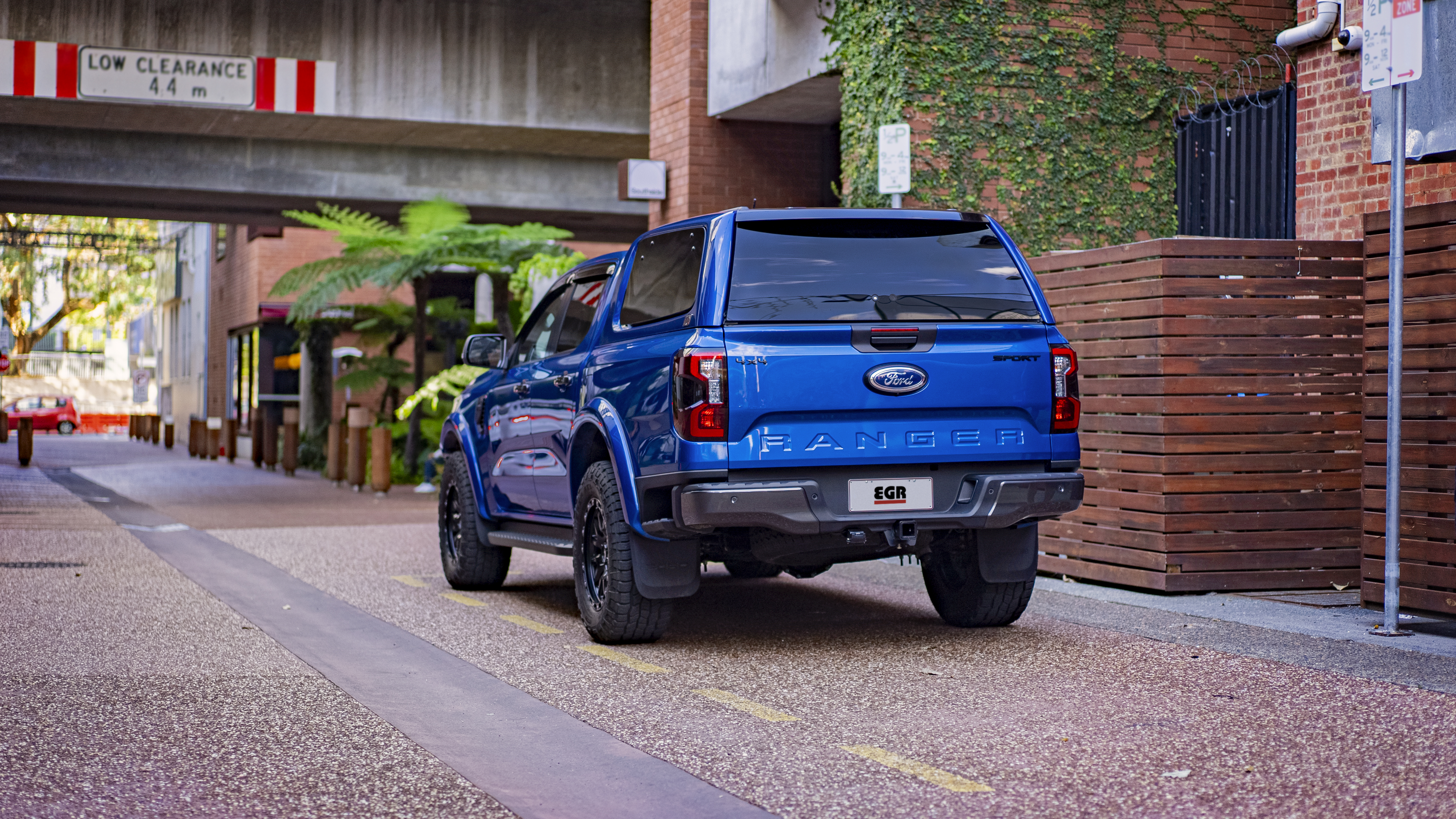 EGR-equipped Ford Ranger with canopy and rear bumper in an urban laneway