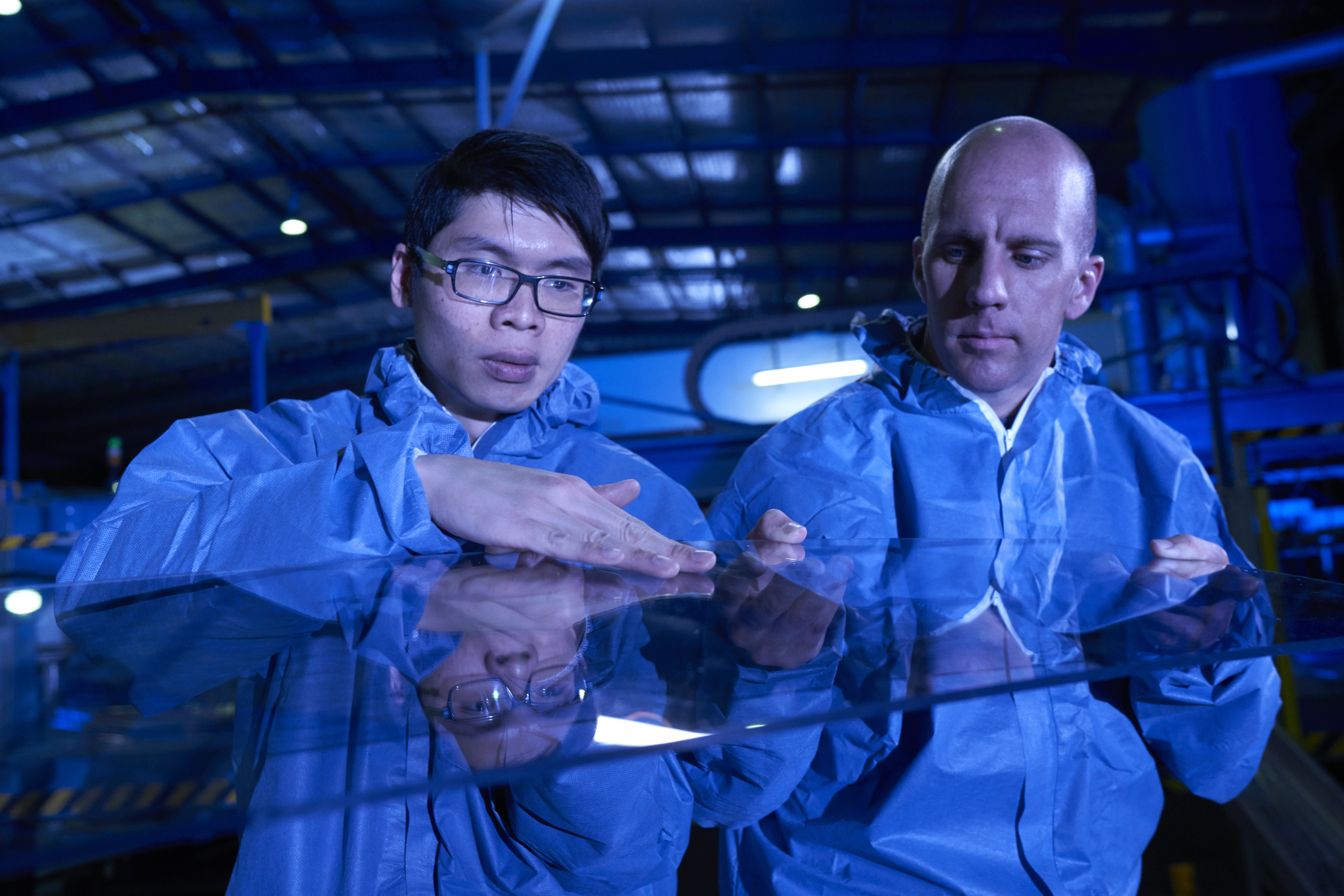 EGR workers reviewing product on factory floor