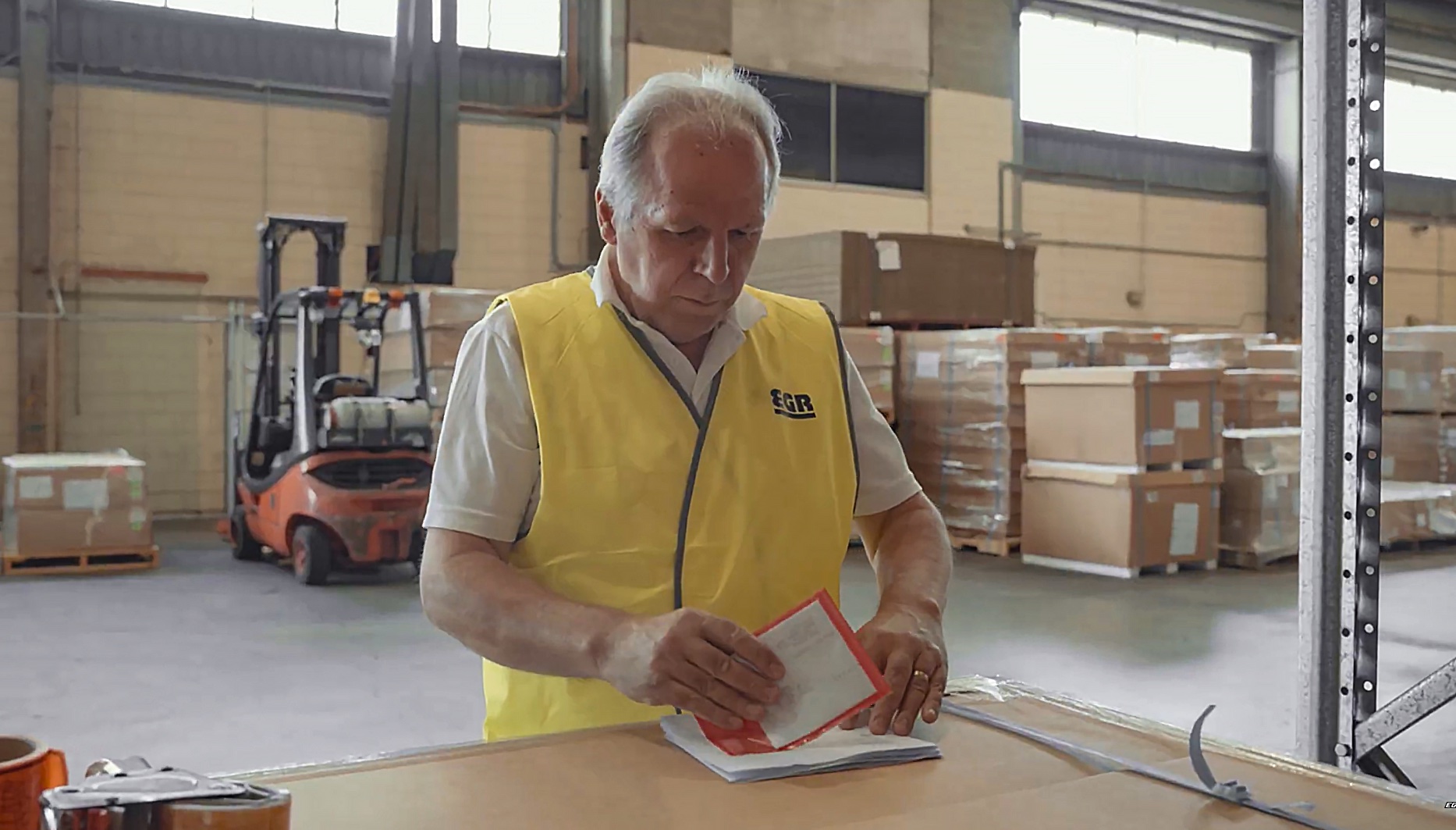 EGR team member checking a quality documentation label before dispatch